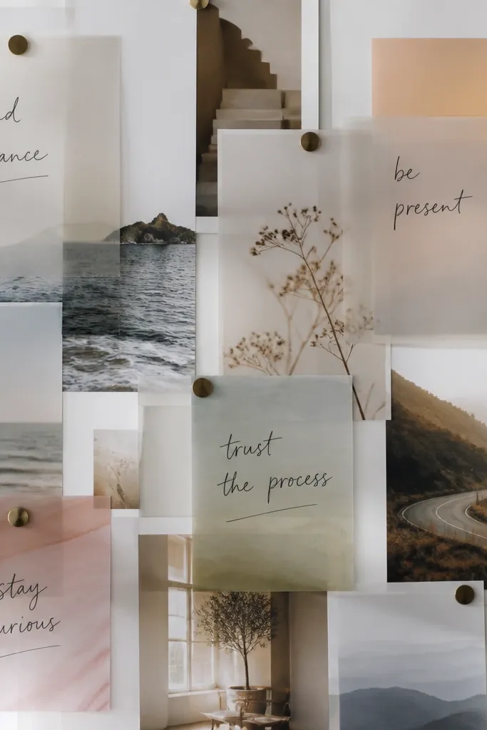 A board featuring semi-transparent acetate overlays placed over printed photos; the overlays show soft gradients and handwritten goals; the photos appear layered and slightly muted.