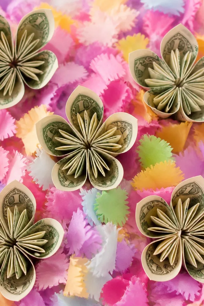 Money flowers surrounded by small tissue petals with fringed edges, like confetti, in bright colors.