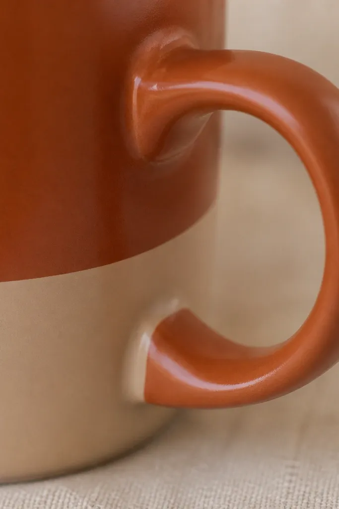 A close-up of the mug handle with clean paint boundaries and no drips, showing the handle base where scuffs used to be.